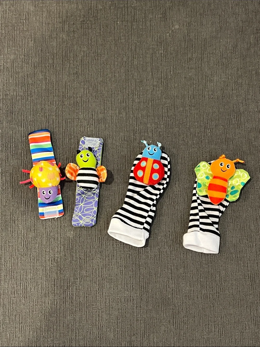 Like New Set of 4 Baby Wrist and Foot Rattles with Colorful Bug Designs